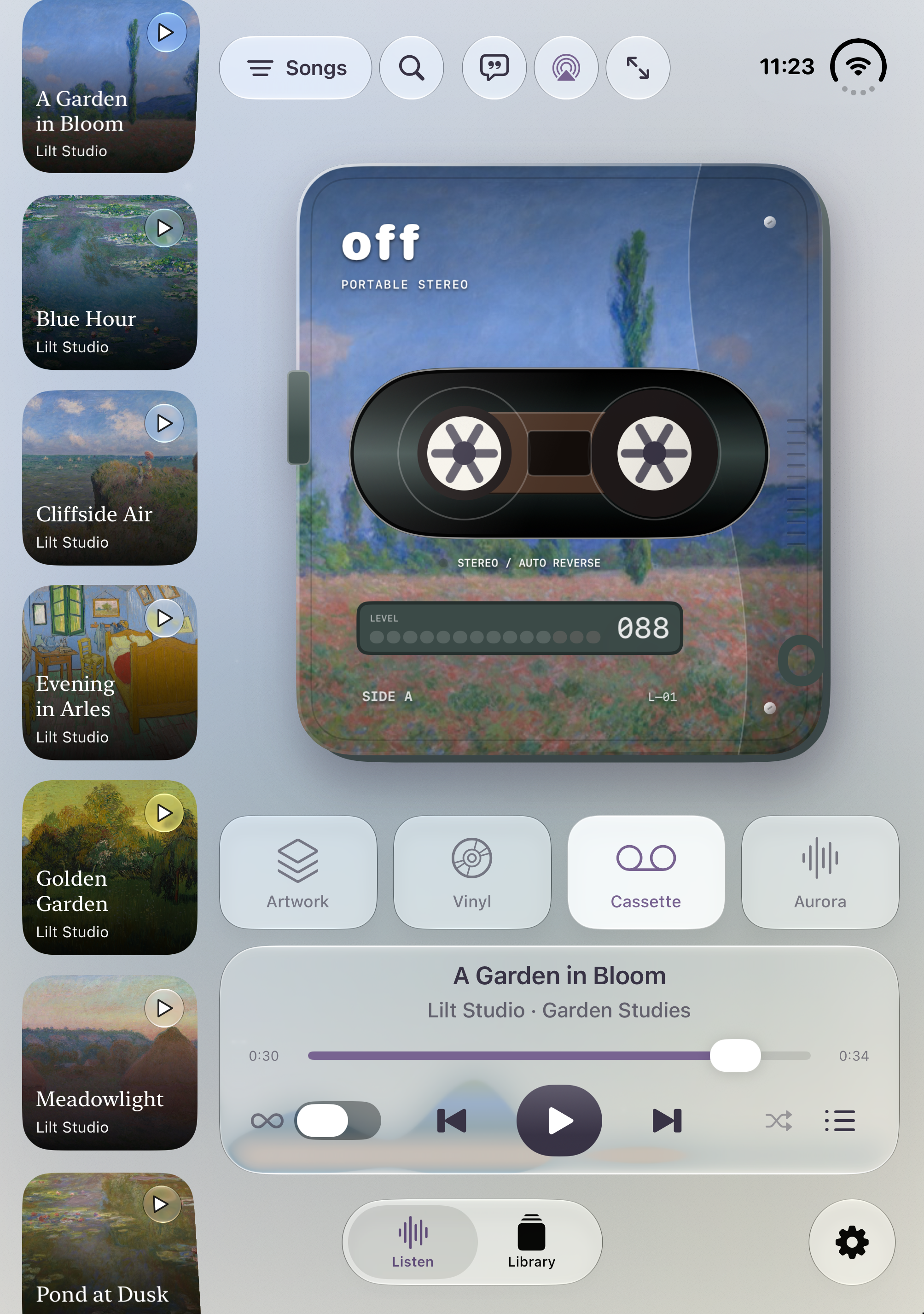 Cassette view on the open iPhone Duo in portrait, with the collection beside the player